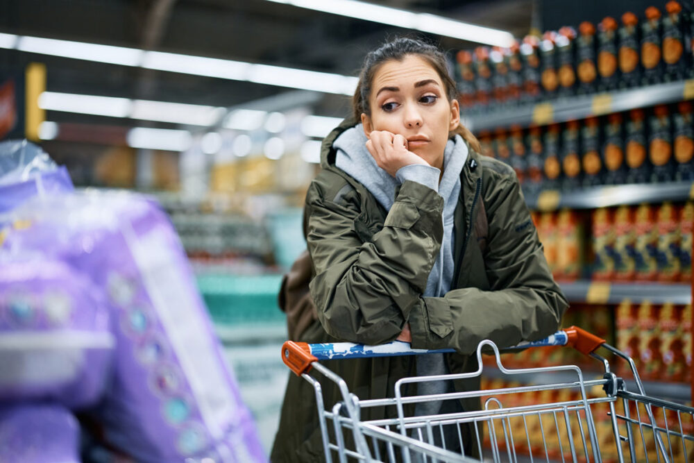 Uk Consumers Empty Covid Saving Coffers As Funds Used To Supplement Cost-Of-Living Spending Dry Up 1 young worried woman looking at rising prices while 2023 11 27 05 10 26 utc
