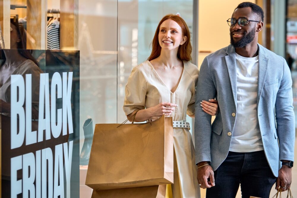 Uk Retail Traffic +4.8% Year-On-Year On Black Friday 2024, According To Sensormatic Solutions Shoppertrak Analytics 1 joyful diverse couple taking part in black friday 2024 05 10 23 49 36 utc Large